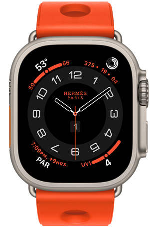 Apple Watch Hermès Ultra 3, analoges Zifferblatt Circulaire, (Stunden-, Minuten- und Sekundenzeiger, Komplikationen: Wetter, Aktivitätsringe, Paris Zeit und UV Index), Titangehäuse, Farbe Natur, rechte Seite, Digital Crown, erhöhte Seitentaste, kombiniert mit Scub’H Diving Armband, Farbe Orange Néon (leuchtendes Orange), geformtes Gummi, kreisförmige Aussparungen in der Mitte