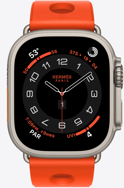 Apple Watch Hermès Ultra 3, analoges Zifferblatt Circulaire, (Stunden-, Minuten- und Sekundenzeiger, Komplikationen: Wetter, Aktivitätsringe, Paris Zeit und UV Index), Titangehäuse, Farbe Natur, rechte Seite, Digital Crown, erhöhte Seitentaste, kombiniert mit Scub’H Diving Armband, Farbe Orange Néon (leuchtendes Orange), geformtes Gummi, kreisförmige Aussparungen in der Mitte