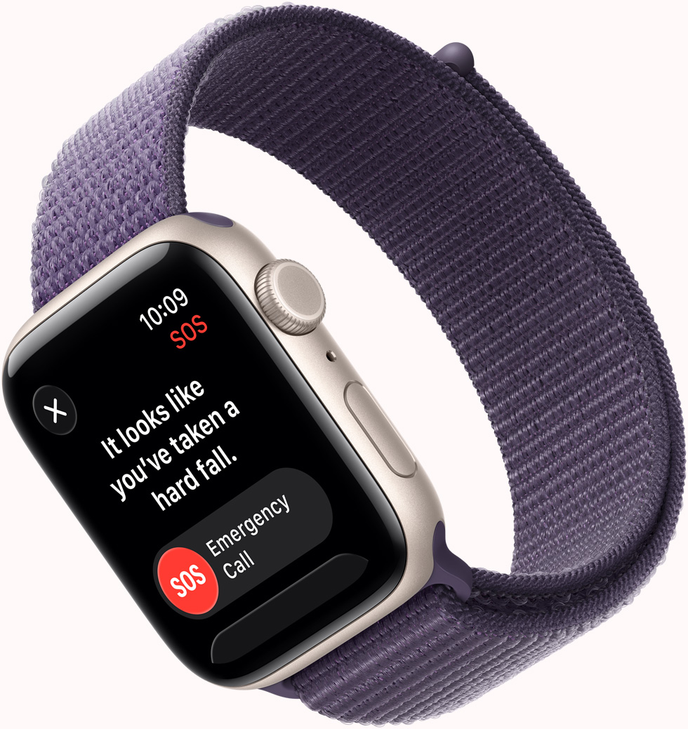 Apple Watch SE 3，星光色鋁金屬錶殼，展示 SOS 跌倒偵測通知、撥打緊急電話按鈕，機身右側設有數碼錶冠、咪高風、側邊按鈕，配搭霧紫色運動手環